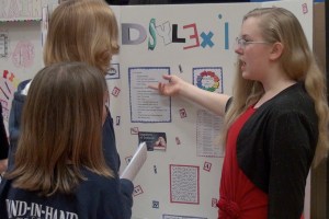 Faith talks about her science display.